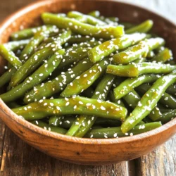- 1 pound fresh green beans - 2 tablespoons soy sauce - 1 tablespoon fresh ginger, grated - 2 cloves garlic, minced - 1 tablespoon sesame oil - 1 tablespoon honey or maple syrup - 1 tablespoon rice vinegar - 1 tablespoon sesame seeds (for garnish) - Salt and pepper to taste - Optional: 1 teaspoon red pepper flakes (for heat) I love using fresh green beans for this dish. They bring a nice crunch and vibrant color. For the glaze, I use soy sauce, which adds a salty depth. Fresh ginger gives warmth and spice. Garlic adds a punch of flavor. Sesame oil is rich and nutty, enhancing the dish. Honey or maple syrup adds a touch of sweetness. Rice vinegar brightens everything up. I sprinkle sesame seeds on top for a nice crunch. If you want some heat, add red pepper flakes. You can adjust each ingredient to suit your taste. Each one plays a role in making these green beans shine. Start by bringing a large pot of salted water to a boil. This step is key. The salt helps flavor the beans. Once the water boils, add 1 pound of trimmed green beans. Blanch them for about 3-4 minutes. You want them bright green and a bit tender, but still crisp. Drain the beans and quickly transfer them to a bowl of ice water. This stops the cooking. After a few minutes in the ice water, drain them again and set aside. In a small bowl, whisk together the glaze ingredients. Combine 2 tablespoons of soy sauce, 1 tablespoon of grated ginger, and 2 minced garlic cloves. Add 1 tablespoon of sesame oil for richness. For sweetness, mix in either 1 tablespoon of honey or maple syrup. Finish with 1 tablespoon of rice vinegar for a nice zing. If you like heat, add 1 teaspoon of red pepper flakes. This glaze will bring great flavor to your beans. In a large skillet, heat a splash of sesame oil over medium heat. Once hot, add the blanched green beans. Sauté them for about 2-3 minutes until they are heated through. Then, pour the ginger soy glaze over the green beans. Toss to coat them evenly. Let the mixture cook for another 2-3 minutes. This allows the glaze to thicken and coat the beans nicely. Finally, season with salt and pepper to taste. Enjoy your delicious green beans! To make the green beans just right, watch your cooking time. Sauté them for only 2-3 minutes after blanching. This keeps them crisp and fresh. For the best texture, use medium heat. High heat can burn them. Stir often to coat each bean in the glaze. This helps them stay crunchy and bright. If you want a different flavor, try these swaps. Instead of soy sauce, use tamari for a gluten-free option. You can also use coconut aminos for a sweeter taste. For those with dietary needs, replace honey with maple syrup for vegan-friendly sweetness. If garlic isn’t your thing, skip it or use shallots instead. These green beans pair well with many main dishes. Try them with grilled chicken or salmon for a tasty meal. They also match nicely with rice or quinoa. For special occasions, plate the beans in a beautiful dish. Top with extra sesame seeds for a nice touch. You can also add a squeeze of lemon for brightness. {{image_2}} You can make Ginger Soy Glazed Green Beans even better by adding protein. Chicken works great here. Simply grill or sauté diced chicken. Stir it into the green beans when you add the glaze. Tofu is another option. Press it, cut it, and pan-fry until golden. This gives a nice texture and flavor. Toss in the tofu with the green beans for a tasty mix. Want more heat? You can adjust the spice in this dish easily. Try using different types of peppers. For mild heat, add a few slices of jalapeño. For more kick, use serrano peppers. If you like it really spicy, add more red pepper flakes. Just remember to start small and taste as you go. This way, you control the heat just right for your taste. This dish can easily become plant-based. Simply skip the honey and use maple syrup instead. This keeps the sweetness while making it vegan. If you add tofu, it gives the dish a protein boost. You can also mix in other veggies. Try adding bell peppers or carrots for color and crunch. This way, you can enjoy a delicious, colorful meal that fits any diet. To store leftovers, place the green beans in an airtight container. This keeps them fresh. You can also use plastic wrap over a plate. In the fridge, they last about three to four days. The beans may lose some crunch but will still taste good. To freeze green beans, start by blanching them as you did before. After cooling, drain well and spread them on a baking sheet. Freeze them for about two hours. Once frozen, transfer beans to a freezer bag. Remove as much air as possible. They can last up to three months in the freezer. When you thaw them, the texture may change. They might become softer. However, they will still have great flavor. Use them in stir-fries or soups for the best results. Blanching time is key. For softer beans, blanch them for 5-6 minutes instead of 3-4. This gives them time to cook through. After blanching, cool the beans in ice water to stop cooking. This helps keep their bright color while softening them just right. Yes, you can use frozen beans! Just skip the blanching step. Instead, heat the frozen beans in the skillet with sesame oil. Cook them for 5-7 minutes until they are hot. Then, add the glaze and mix well. Frozen beans tend to be softer, so keep an eye on them. These green beans match well with many meals. Try serving them with grilled chicken or fish for a fresh twist. They also go great with rice dishes or stir-fries. Add them to your next Asian-inspired meal for a tasty side! The blog post guides you through making Ginger Soy Glazed Green Beans. We discussed ingredients, from fresh green beans to flavorful glazes. You learned step-by-step cooking methods, including preparation, sautéing, and tips for perfecting your dish. In the end, this recipe is versatile, offering options for spice levels and dietary needs. Whether you enjoy them alone or as a side, these beans are simple yet impactful. You can master this dish and impress your family or guests with ease. Enjoy your cooking!