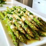 You need 1 pound of fresh asparagus. Make sure to trim the ends. This helps the asparagus cook evenly. Look for bright green color and firm stalks at the store. Use 2 tablespoons of olive oil. This adds flavor and helps the seasonings stick. Olive oil also gives the asparagus a nice, crisp texture when cooked. You will need 4 cloves of minced garlic. This gives the dish its rich flavor. Add 1/2 teaspoon of salt and 1/4 teaspoon of black pepper for seasoning. If you like heat, toss in 1/4 teaspoon of red pepper flakes. Don't forget the zest of 1 lemon and 1 tablespoon of lemon juice for brightness. Use 1/4 cup of grated Parmesan cheese. This adds a salty, creamy taste. Finally, chop some fresh parsley for garnish. It brings color and a fresh taste to the dish. Start by washing the asparagus under cool water. Trim the tough ends off each stalk. This helps them cook evenly. Aim for pieces that are about the same length. In a big bowl, mix together 2 tablespoons of olive oil, 4 minced garlic cloves, 1/2 teaspoon of salt, and 1/4 teaspoon of black pepper. If you want some heat, add 1/4 teaspoon of red pepper flakes. Next, add the zest of 1 lemon and 1 tablespoon of lemon juice. Stir it all together until combined. Preheat your air fryer to 390°F (200°C). This usually takes about 5 minutes. Preheating helps the asparagus cook faster and get that nice crunch. Place the coated asparagus in the air fryer basket. Make sure to arrange them in a single layer. If your air fryer is small, you might need to cook in batches. Cook for 8-10 minutes. Shake the basket halfway through cooking to ensure even crisping. Once the asparagus is done, take it out of the air fryer. Immediately sprinkle 1/4 cup of grated Parmesan cheese on top. This makes the cheese melt a bit. For a lovely touch, add chopped fresh parsley as a garnish. Enjoy your delicious snack! Choose fresh asparagus that is firm and bright green. Look for tips that are closed and compact. Thin stalks work well for a tender bite. If you see any yellowing, skip those. Freshness makes a big difference in taste. Cooking time depends on the thickness of your asparagus. Thin stalks need about 8 minutes. Thicker ones may take up to 10 minutes. Always check for tenderness. Shake the basket halfway through to cook evenly. If you like it crispier, add another minute. For the best cheese melt, sprinkle the Parmesan right after cooking. The heat from the asparagus helps it melt nicely. If you want it extra gooey, add more cheese! You can also use a little extra olive oil to help it stick. {{image_2}} You can mix in other vegetables for a colorful dish. Try bell peppers, carrots, or zucchini. These veggies add crunch and flavor. Cut them into similar sizes for even cooking. Toss them with the same garlic mixture. This will create a fun medley of tastes. All the veggies will cook well together in the air fryer. Feel free to change up the seasonings. You can use Italian herbs like oregano or thyme. They add a nice touch. A sprinkle of smoked paprika gives a hint of warmth. For a spicy kick, add more red pepper flakes. Experiment with your favorite spices for a unique flavor. This will keep your dish fresh and exciting. If you want to try different cheeses, go ahead! Grated Pecorino Romano adds a sharper taste. Nutritional yeast is a great choice for a vegan option. It gives a cheesy flavor without dairy. You can also use feta cheese for a tangy twist. Each cheese will change the taste and feel of the dish. Enjoy discovering your favorite! After cooking, let the garlic Parmesan asparagus cool. Place it in an airtight container. Store it in the fridge for up to three days. This keeps the flavors fresh and the asparagus crisp. To reheat, use the air fryer for best results. Set it to 350°F (175°C). Cook for about 3-5 minutes. This method restores the crispness while warming the asparagus. You can also use a microwave, but it may lose some crunch. You can freeze garlic Parmesan asparagus, but it may change texture. Blanch the asparagus first by boiling for 2-3 minutes. Then, cool it in ice water. Drain and pack it in a freezer-safe bag. It can last up to three months in the freezer. When ready to eat, thaw it overnight in the fridge before reheating. Yes, you can use frozen asparagus. Thaw it first and drain any water. Keep in mind that frozen asparagus may not be as crisp as fresh. Adjust the cooking time to ensure it cooks well. To boost flavor, add more garlic or lemon juice. You can also try using different herbs like thyme or rosemary. A splash of balsamic vinegar can also add depth. Experiment to find what you love! You can cook at a lower temperature, but adjust the time. Cooking at 350°F will take longer, about 12-15 minutes. The asparagus will still taste great, but might not get as crispy. This dish pairs well with grilled chicken or fish. You can also serve it with pasta or as part of a salad. It's a great side for any meal! To serve more people, simply double or triple the ingredients. Make sure to cook in batches if your air fryer is small. Keep the asparagus in a warm oven to stay hot while you finish cooking. This article covers all you need for making garlic parmesan asparagus. You learned about key ingredients like fresh asparagus, olive oil, and garlic. The steps to prepare and cook it in an air fryer are simple. Try different seasonings, add veggies, or choose other cheeses. Don't forget the best ways to store leftovers. With these tips, you can enjoy great, quick meals. Get ready to impress your family and friends with this tasty side dish.