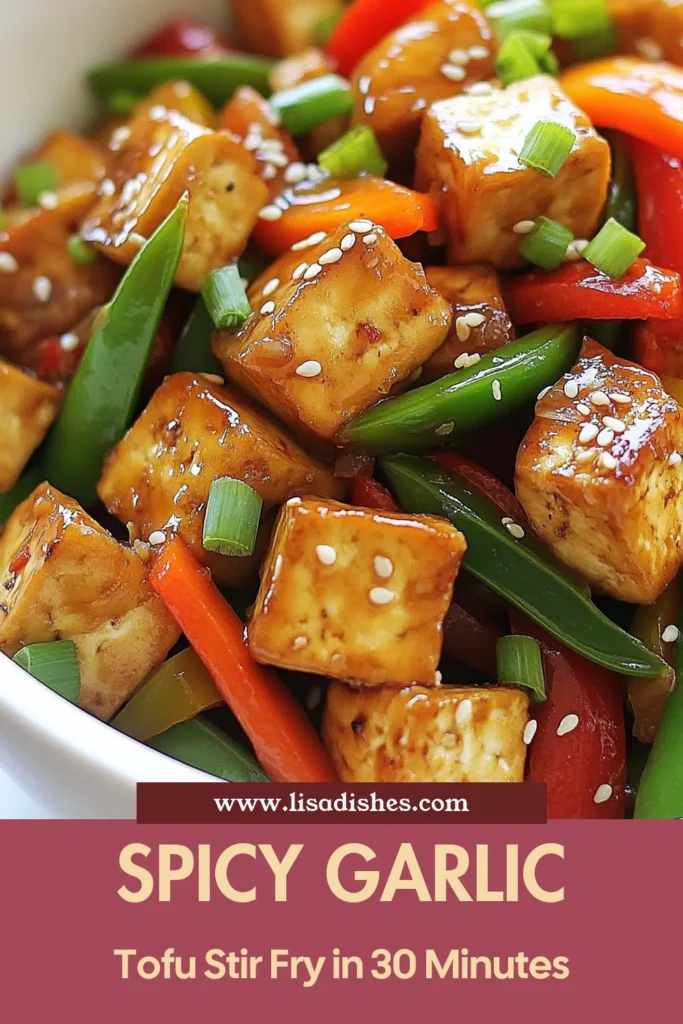 Discover a delicious and easy Chili Garlic Tofu Stir-Fry that's perfect for a quick tofu dinner! This chili garlic tofu recipe combines crispy tofu with vibrant vegetables in a flavorful vegan stir-fry. Perfect for busy weeknights, this spicy tofu dish is ready in just 30 minutes. Try this tofu stir-fry with vegetables for a delightful meal that will spice up your dinner rotation. Save this recipe for an amazing vegan treat! #ChiliGarlicTofu #VeganStirFry #TofuRecipes #QuickDinnerIdeas
