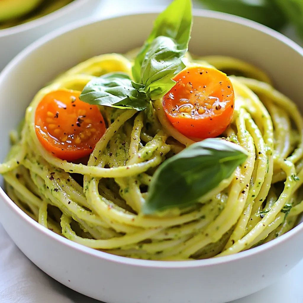 - 2 ripe avocados - 1 cup fresh basil leaves - 2 cloves garlic - 1 tablespoon lemon juice - 1/4 cup olive oil - Salt and pepper - 12 oz spaghetti or fettuccine - 1/4 cup grated Parmesan cheese (optional) - Garnishing options like cherry tomatoes and basil leaves To create this creamy avocado pasta, start with fresh ingredients. Ripe avocados form the base of the sauce. Their creamy texture gives the dish its rich mouthfeel. Fresh basil adds a burst of flavor. Garlic brings depth and a bit of kick. Use two ripe avocados, a cup of fresh basil leaves, and two cloves of garlic for the best taste. Next, gather pantry items. Lemon juice brightens the sauce and adds a tangy twist. Olive oil provides healthy fats that enhance the creaminess. Don’t forget salt and pepper to season the dish to your liking. For the pasta, you can choose either spaghetti or fettuccine. I prefer fettuccine for its wide shape, which holds the sauce well. If you like, sprinkle on some grated Parmesan cheese for added flavor. For garnishing, cherry tomatoes and extra basil leaves are perfect. They add color and freshness to your plate. {{ingredient_image_1}} To start, get a big pot. Fill it with water and add salt. Bring the water to a boil. Once it bubbles, add the pasta. I like using spaghetti or fettuccine. Cook it until it's al dente, usually around 8 to 10 minutes. Al dente means the pasta is firm but not hard. Before you drain it, save about 1 cup of that pasta water. This water is useful later. Drain the pasta and set it aside. Now, let’s make the sauce. Grab your food processor. Add the ripe avocados, fresh basil, minced garlic, lemon juice, and olive oil. Blend everything until it's smooth and creamy. If the sauce feels too thick, add a bit of the pasta water. Start with a couple of tablespoons. Keep blending until you reach a nice, creamy texture. In a large mixing bowl, toss the drained pasta with the avocado sauce. Mix it well so every bit of pasta is coated. If the sauce doesn’t stick, add more reserved pasta water. This helps the sauce cling. Season with salt and pepper to taste. If you want, stir in some grated Parmesan cheese for extra flavor. Now, your creamy avocado pasta is ready to serve! To make a creamy avocado sauce, start with ripe avocados. They should feel soft but not mushy. Use a food processor for a smooth blend. Add fresh basil and garlic for great flavor. - Key techniques for a creamy texture: Blend the avocados, basil, garlic, olive oil, and lemon juice together. If it’s too thick, add a bit of the reserved pasta water. This helps reach the right consistency. - Adding flavors with garlic and lemon: Garlic adds a nice bite, while lemon brings brightness. Adjust the lemon juice to match your taste. A little zest can also enhance the flavor. Cooking pasta well is key to your dish. You want it to be al dente, which means firm to the bite. - Al dente vs. overcooked pasta: Al dente pasta holds its shape and provides texture. Overcooked pasta becomes soft and mushy, losing its appeal. - How to know when pasta is done: Follow the package instructions for cooking time. Taste a piece a minute before the time is up. It should be firm yet tender. How you serve your dish matters. A good plate can make your meal look even better. - Plating techniques for visual appeal: Use a large bowl to toss your pasta. Then, use tongs to twirl it into a mound on the plate. This creates height and interest. - Garnishing tips for added flavor and color: Top your pasta with halved cherry tomatoes and extra basil leaves. This adds color and freshness. A sprinkle of Parmesan cheese can also enhance the dish's look and taste. Pro Tips Choose Ripe Avocados: Make sure your avocados are perfectly ripe for a creamy sauce. They should yield slightly to pressure when gently squeezed. Add a Kick: For a spicy twist, consider adding a pinch of red chili flakes or a dash of hot sauce to your avocado sauce. Use Fresh Ingredients: Fresh basil will elevate the flavor of your sauce. If possible, use freshly picked basil for the best aroma and taste. Experiment with Nuts: For added texture and flavor, blend in some toasted pine nuts or walnuts into the avocado sauce. {{image_2}} You can boost the protein in your creamy avocado pasta easily. Adding grilled chicken or shrimp makes the dish heartier. Simply grill your protein of choice and mix it in with the pasta. For a vegetarian option, try chickpeas. They add protein and a nice texture. Just toss a cup of cooked chickpeas into the mix for a filling meal. To make your pasta even more exciting, think about flavor enhancements. Different herbs can change the game. Fresh cilantro or parsley can add a bright twist. If you like some heat, sprinkle in red pepper flakes. They will bring a nice kick to the creamy sauce. Just a pinch can elevate each bite. If you need gluten-free options, there are plenty to choose from. Look for gluten-free pasta made from rice or lentils. These options work well with the creamy sauce. Whole wheat pasta is another healthy choice. It adds a nutty flavor and more fiber. You can also explore other whole-grain pastas for added nutrition. To store creamy avocado pasta safely, place leftovers in an airtight container. This will help keep moisture in and air out. You can store it in the fridge for up to two days for the best quality. After that, the taste may change, and the pasta can get mushy. Can creamy avocado pasta be frozen? No, I do not recommend freezing this dish. The avocado sauce can change in texture and taste when thawed. If you want to freeze it anyway, store the pasta and sauce separately. When you're ready to eat, reheat the pasta in a pan with a splash of water. This helps bring back some moisture. To keep the avocado sauce from browning, add a little extra lemon juice. The acid helps slow down the browning process. You can also cover the surface of the sauce with plastic wrap, pressing it against the sauce. This reduces air exposure. To maintain texture after storage, avoid mixing in the sauce until serving. Reheat the pasta gently before adding the sauce to keep it creamy. To make creamy avocado pasta vegan, you can swap out the cheese and any dairy. Instead of Parmesan, try nutritional yeast. It adds a cheesy flavor without using dairy. For the sauce, stick with avocados, garlic, basil, lemon juice, and olive oil. This keeps it rich and creamy, just like the original. Yes, you can prepare this recipe ahead of time. Cook the pasta and make the sauce separately. Store the pasta in the fridge. Keep the sauce in an airtight container. When you're ready to eat, just mix them together. If the sauce is thick, add a bit of the reserved pasta water to loosen it up. Creamy avocado pasta goes well with many dishes. Try a fresh garden salad with greens and a light vinaigrette. Grilled vegetables also make a great side. For a heartier meal, serve it with garlic bread or roasted chickpeas. These pairings enhance the meal and add variety to your plate. This article covered how to make a delicious creamy avocado pasta. We discussed fresh ingredients, pantry staples, and pasta details. I shared easy step-by-step instructions, tips for perfection, and fun variations. Finally, I included storage guidelines to keep your leftovers fresh. Experiment with your unique flavors and enjoy this tasty dish. It’s quick, fun, and fits any meal. Happy cooking!