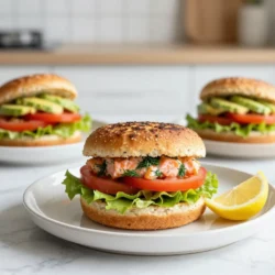To make your Lemon Dill Salmon Burgers, gather these key ingredients: - 1 lb fresh salmon fillets, skin removed - 1/4 cup breadcrumbs (preferably whole wheat) - 2 tablespoons fresh dill, finely chopped - 1 tablespoon lemon zest - 2 tablespoons lemon juice - 1 garlic clove, minced - 1/4 teaspoon black pepper - 1/2 teaspoon salt - 1/4 cup green onions, finely chopped - 1 tablespoon mayonnaise (optional for moistness) - 4 whole grain burger buns - Lettuce leaves, tomato slices, and avocado for toppings You can add a few optional ingredients to boost the flavor: - Red onion slices for a sharp bite - A pinch of cayenne pepper for heat - Capers for a briny touch - Sliced pickles for tang If you have dietary needs, consider these substitutions: - Use gluten-free breadcrumbs for a gluten-free option. - Replace salmon with canned tuna or white fish for a different taste. - Substitute mayonnaise with Greek yogurt for a lighter spread. - For vegan options, use mashed chickpeas or black beans as a base. {{ingredient_image_1}} To start, take one pound of fresh salmon fillets and remove the skin. You want the fish to be clean and ready. Next, place the salmon in a food processor. Pulse it until it is finely chopped but still a bit chunky. If you don’t have a food processor, you can chop the salmon by hand with a sharp knife. Just be sure to get nice, even pieces. In a large bowl, combine the chopped salmon with 1/4 cup of breadcrumbs, 2 tablespoons of fresh dill, 1 tablespoon of lemon zest, and 2 tablespoons of lemon juice. Add 1 minced garlic clove, 1/4 teaspoon of black pepper, and 1/2 teaspoon of salt. Toss in 1/4 cup of finely chopped green onions. If you want extra moistness, mix in 1 tablespoon of mayonnaise. Use a fork to stir everything gently together until just combined. Now, divide this mixture into four equal parts. Shape each part into a patty, making them about 3/4 inch thick. This thickness helps them cook evenly. After forming the patties, place them on a plate and cover them. Chill the patties in the fridge for at least 30 minutes. This step is key. It helps the patties hold together while cooking. Next, heat a non-stick skillet over medium heat. Lightly grease it with olive oil. Cook the patties for about 4 to 5 minutes on each side. You want them to turn golden brown and be cooked through. The internal temperature should reach 145°F (63°C). While the patties cook, toast your whole grain burger buns in the same skillet for a minute. This adds a nice crunch. When ready, layer lettuce on the bottom half of each bun. Place a salmon patty on top, then add tomato slices and avocado. Finally, put the top half of the bun on. Serve your burgers right away with a lemon wedge on the side. This adds a burst of flavor that you will love! To make the best salmon patties, follow these tips: - Choose Fresh Salmon: Fresh salmon gives the best flavor. Check for bright color and no smell. - Don’t Overmix: Mix the ingredients gently. Overmixing can make the patties tough. - Chill Before Cooking: Chill the shaped patties for at least 30 minutes. This helps them hold their shape. - Watch the Heat: Cook on medium heat. Too high and they may burn; too low and they won’t brown. - Check the Temperature: Cook until the internal temperature is 145°F (63°C) for safety. Presentation matters! Here are some ideas: - Use a Wooden Board: Serve the burgers on a wooden board for a rustic look. - Garnish with Fresh Herbs: Add extra dill on top for color and freshness. - Lemon Wedges: Place lemon wedges on the side. They add a burst of flavor when squeezed. - Colorful Plates: Use colorful plates to make the dish pop. Bright colors make food more appealing. Choose sides that complement your salmon burgers: - Sweet Potato Fries: They add sweetness and crunch. - Salad: A light salad with mixed greens and a lemon vinaigrette works well. - Coleslaw: The crunch contrasts nicely with the soft burger. - Grilled Veggies: Grilled zucchini or bell peppers add flavor and nutrition. - Quinoa Salad: A healthy, filling option to serve alongside your burgers. Pro Tips Use Fresh Ingredients: Always opt for fresh salmon and herbs to enhance the flavor of your burgers. Fresh ingredients make a noticeable difference in taste! Don’t Overmix: When combining the ingredients, mix gently to keep the salmon's texture. Overmixing can lead to a dense patty. Chill for Better Binding: Chilling the patties for at least 30 minutes before cooking helps them hold their shape and prevents them from falling apart. Experiment with Toppings: Feel free to customize your toppings! Try adding a spicy aioli or pickled red onions for an extra kick. {{image_2}} You can play with the ingredients to change the taste. Try adding capers for a briny kick. A dash of smoked paprika can give it a nice depth. Swap out fresh dill for basil or cilantro for a fresh twist. If you like spice, add a pinch of cayenne pepper. You could even mix in some feta cheese for a creamy texture. These small changes can make a big difference in flavor. The bun you choose can change the whole burger experience. Whole grain buns are great for health. You can use lettuce wraps for a low-carb option. If you want something different, try pita bread or ciabatta rolls. Each bread type adds its own unique flavor and texture. Don't forget to toast the buns for extra crunch! If you want to go meatless, try a chickpea or black bean patty. You can also mix in veggies like zucchini or sweet potatoes. For a seafood twist, use shrimp or crab instead of salmon. Just chop them finely and follow the same mixing method. These options keep the burger fresh and exciting, while still being healthy! Store leftover salmon burgers in an airtight container. Make sure to let them cool first. Place a piece of parchment paper between layers to avoid sticking. They can stay fresh in the fridge for up to three days. If you want to keep them longer, freezing is a great option. To freeze salmon burgers, wrap each patty tightly in plastic wrap. Then place them in a freezer-safe bag or container. They can be frozen for up to three months. When you are ready to eat, just thaw them overnight in the fridge. Reheat your salmon burgers on the stovetop for the best results. Use a non-stick skillet over medium heat. Heat each patty for about three minutes on each side. This warms them through without drying them out. If you prefer the oven, preheat it to 350°F (175°C) and bake for about 10 minutes. Enjoy your flavorful meal! Yes, you can use canned salmon in this recipe. Just drain it well and flake it into small pieces. Canned salmon can save time and is convenient. It also adds a nice flavor. However, fresh salmon gives a better texture and taste. If you choose canned, try to pick wild-caught for better health benefits. These burgers pair well with many sides. Here are some great options: - Sweet potato fries - Mixed green salad - Quinoa salad - Coleslaw - Grilled vegetables Each option adds flavor and texture. You can also serve the burgers with a lemon wedge for a tangy kick. To make these burgers gluten-free, you can swap out the breadcrumbs. Use gluten-free breadcrumbs or ground oats instead. Check the buns too; look for gluten-free options in stores. This way, you keep all the flavors while making it safe for gluten-free diets. You’ve learned how to make delicious salmon burgers. We covered what you need, step-by-step instructions, and tips for success. Know that you can mix in flavors to suit your taste. You can also store leftovers or freeze them for later. Remember, making meals at home is fun and healthy. Enjoy each bite and feel proud of your cooking. These burgers will impress anyone at your table. Happy cooking!