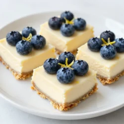 To make these tasty bars, you need a few simple ingredients: - 1 ½ cups graham cracker crumbs - ½ cup unsalted butter, melted - 2 tablespoons granulated sugar - 16 ounces cream cheese, softened - ¾ cup granulated sugar - 2 large eggs - 2 tablespoons lemon juice - Zest of 1 lemon - 1 teaspoon vanilla extract - 1 cup fresh blueberries (or frozen) These ingredients come together to create a creamy and zesty dessert. You can change some ingredients if you want. Here are a few ideas: - Instead of graham cracker crumbs, use crushed cookies or oat flour for a gluten-free option. - Swap unsalted butter with coconut oil for a dairy-free version. - Use Greek yogurt instead of cream cheese for a lighter filling. - Frozen blueberries work well too if fresh ones are not available. Feel free to get creative with these swaps! To keep your bars fresh and tasty, consider these tips: - Use fresh blueberries for the best flavor. They add a burst of sweetness. - Store the bars in an airtight container to keep them moist. - Always refrigerate them after making to maintain freshness. They are best served cold. - If you have leftovers, enjoy them within a week for optimal taste. Following these tips will ensure your lemon blueberry cheesecake bars stay delightful! {{ingredient_image_1}} First, set your oven to 350°F (175°C). Grease a 9x9-inch baking pan. You can also line it with parchment paper. This step helps you lift the bars out easily later. In a medium bowl, mix 1 ½ cups of graham cracker crumbs, ½ cup of melted unsalted butter, and 2 tablespoons of sugar. Stir until it forms a crumbly texture. Once mixed, press this mixture into the bottom of your prepared pan. Make sure it’s even. Bake the crust for 10 minutes. Let it cool slightly after baking. While the crust cools, grab a large mixing bowl. Beat 16 ounces of softened cream cheese with ¾ cup of sugar. Use an electric mixer to get it smooth and creamy. Add 2 large eggs, one at a time. Mix well after each egg. Then, pour in 2 tablespoons of lemon juice, the zest of 1 lemon, and 1 teaspoon of vanilla extract. Mix until everything is well combined. Gently fold in 1 cup of fresh blueberries. Be careful not to crush them. Pour the cheesecake batter over the cooled crust. Use a spatula to smooth the top. Bake for 25-30 minutes. The center should be set and not jiggle. Check that the edges are a light golden brown. Once baked, take it out of the oven. Let it cool at room temperature for about 30 minutes. After that, refrigerate for at least 3 hours until fully chilled. Once set, lift the cheesecake out of the pan using the parchment paper. Cut it into squares. For a beautiful presentation, serve the bars on a nice platter. Garnish with extra blueberries and a sprinkle of lemon zest. This adds a fresh look and taste. Enjoy your delicious treat! To get a smooth and creamy texture, start with softened cream cheese. Cold cream cheese makes lumps. Beat it well with sugar until fluffy and smooth. Mix in the eggs one at a time. This keeps the mixture light. Avoid over-mixing after adding the eggs. Over-mixing can cause cracks when baking. One common mistake is not cooling the crust enough. If the crust is hot, it can melt the filling. Another mistake is not folding in the blueberries gently. Crushing them can turn your bars purple. Also, watch the baking time closely. If you bake too long, the bars can dry out. Using fresh lemon juice and zest adds bright flavor. Zest gives a stronger lemon taste. It also makes the bars smell amazing. Always use fresh lemons for the best flavor. Bottled lemon juice lacks the same zing. This small touch makes a big difference in your bars. Pro Tips Use Room Temperature Ingredients: Allow your cream cheese and eggs to sit at room temperature for about 30 minutes before starting. This helps create a smoother batter and prevents lumps. Don't Overmix the Batter: When incorporating the eggs and folding in the blueberries, mix just until combined. Overmixing can lead to a dense texture. Cool Gradually: After baking, let the cheesecake cool at room temperature before refrigerating. This gradual cooling helps prevent cracks on the surface. Chill for Best Results: For the best flavor and texture, refrigerate the cheesecake bars for at least 3 hours, or overnight if possible, to allow the flavors to meld. {{image_2}} You can swap blueberries for other berries. Strawberries and raspberries work great! For strawberries, chop them into small pieces. They add a sweet, juicy bite. Raspberries give a nice tartness. Both options will bring new flavors to your cheesecake bars. Try mixing berries for a fun twist! Want to make these bars gluten-free? You can use gluten-free graham crackers. Look for brands that taste good. Crush them the same way as regular ones. The filling is naturally gluten-free with cream cheese and eggs. This way, everyone can enjoy your delicious treat! You can change the sweetness to fit your taste. If you like it sweeter, add more sugar. Start with one or two extra tablespoons. For less sweetness, cut back on the sugar in the filling. You can also use honey or maple syrup instead of granulated sugar. Just remember to adjust the liquid slightly. This keeps your cheesecake bars creamy and delicious. To keep your lemon blueberry cheesecake bars fresh, store them in an airtight container. Make sure they are cooled completely before you cover them. This way, they won’t get soggy. You can also place parchment paper between layers to avoid sticking. These cheesecake bars can last up to five days in the fridge. Keep them well-covered to maintain their taste and texture. If you notice any signs of spoilage, it’s best to toss them out. You can freeze these bars for up to three months. To freeze, cut them into squares and wrap each piece tightly in plastic wrap. Then, place them in a freezer bag. When you’re ready to enjoy them, take them out and thaw them in the fridge overnight. This helps keep them creamy and delicious. Yes, you can make these bars ahead of time. They taste even better the next day! Just bake and chill them. Store the bars in the fridge for up to three days. This makes them perfect for parties or gatherings. To prevent cracks, mix your batter gently. Avoid overmixing after adding the eggs. Also, bake the bars at a lower temperature. If you see cracks, don’t worry! They can be covered with whipped cream or fresh blueberries. If you want a lighter option, use Greek yogurt. It adds creaminess without all the fat. You can also try mascarpone cheese for a rich flavor. Both options work well in this recipe. Yes, you can use frozen blueberries! Just make sure to thaw and drain them first. This helps keep the batter from becoming too watery. Frozen blueberries are great for this recipe and still taste delicious. Lemon blueberry cheesecake bars are a delightful treat. We covered their key ingredients, tips for freshness, and step-by-step instructions. I showed you the best practices for storage and helpful FAQs. These bars are easy to make and full of flavor. Remember, you can get creative with fruit choices and adjust sweetness to fit your taste. Enjoy making and sharing these tasty bars! They are sure to impress everyone.